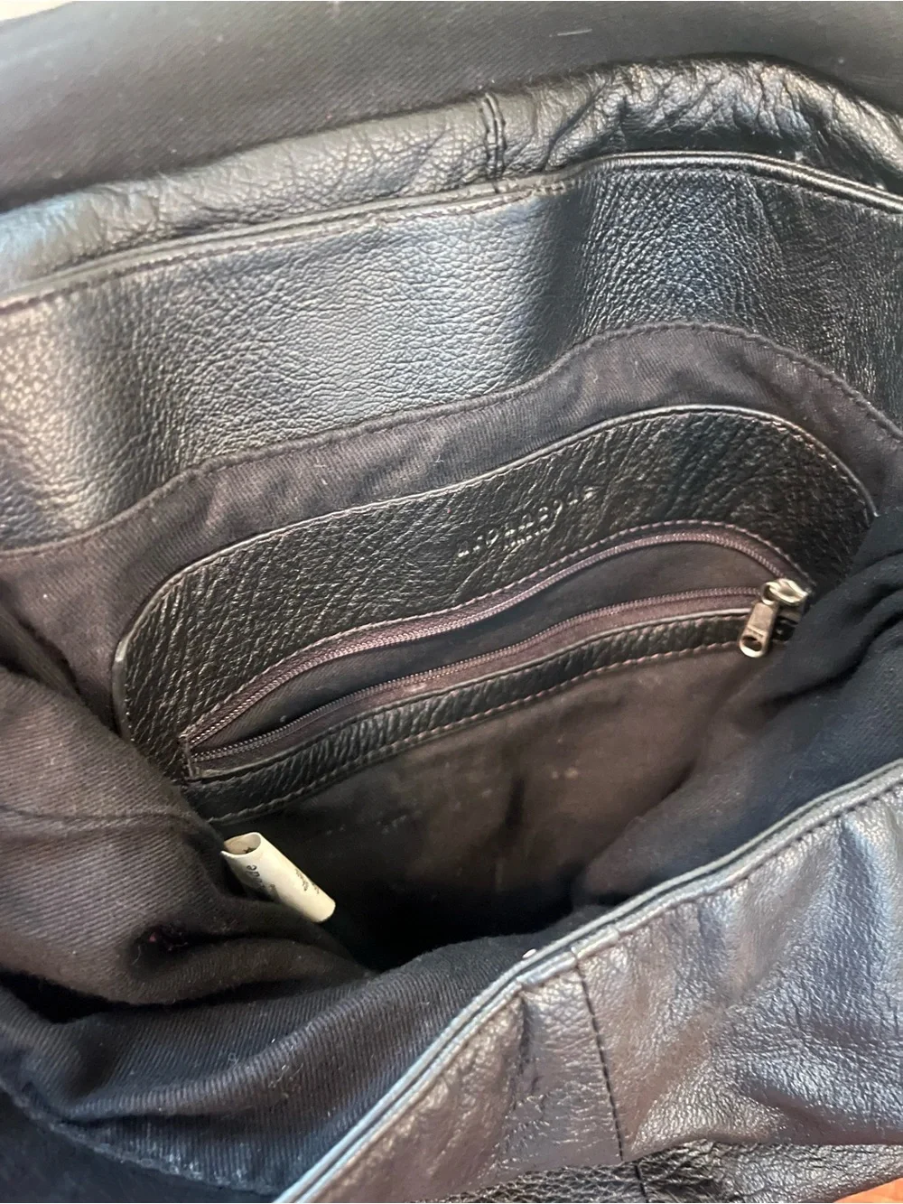 Sleek Black Leather Flap Backpack
